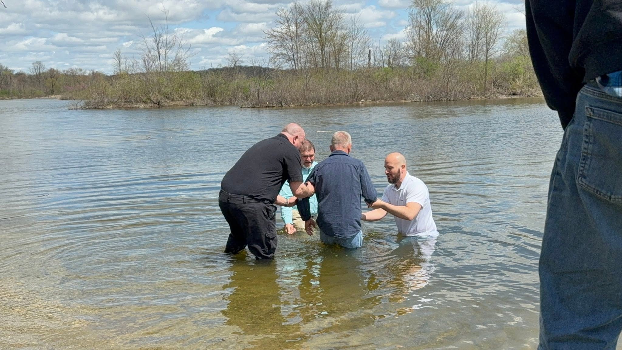Baptism service by the water